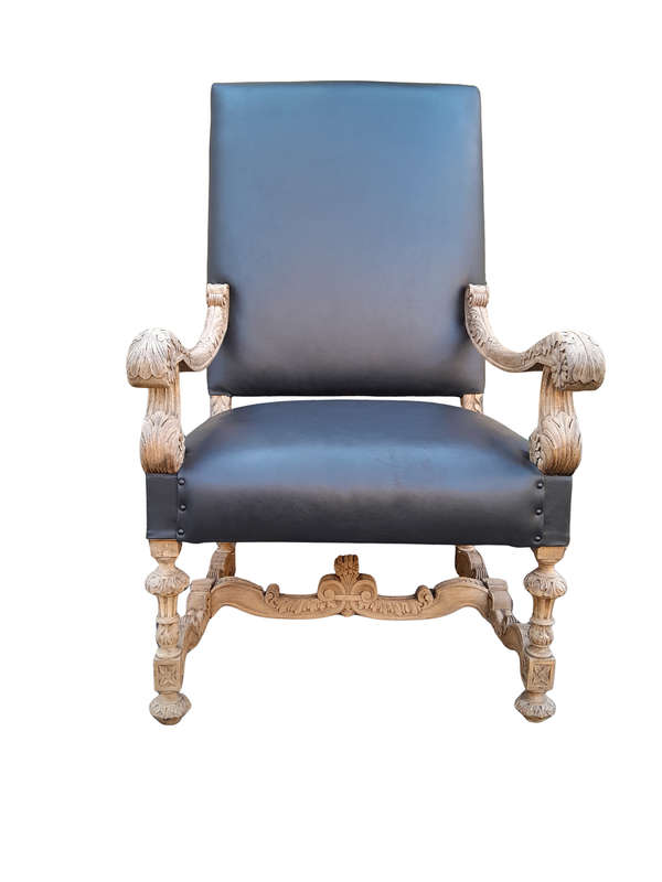 An Antique Ornately Carved Oak Throne Armchair Upholstered in Leather and in a Contemporary Bleac...