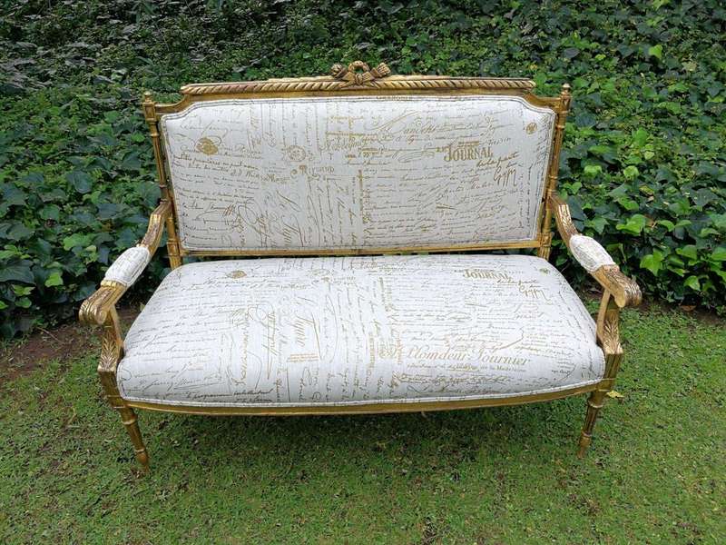 A French Style Hand-Gilded Beechwood Settee Upholstered In A Custom-Made Handmade Linen With Scri...