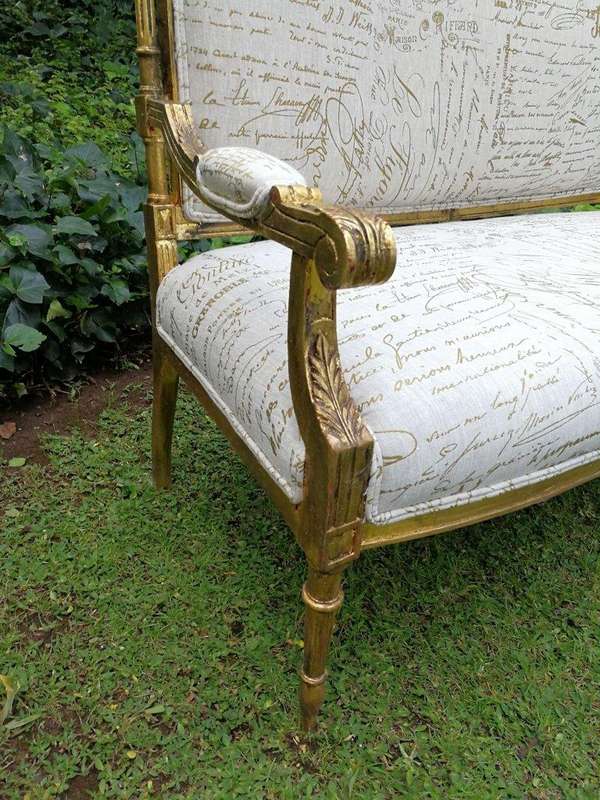 A French Style Hand-Gilded Beechwood Settee Upholstered In A Custom-Made Handmade Linen With Scri...