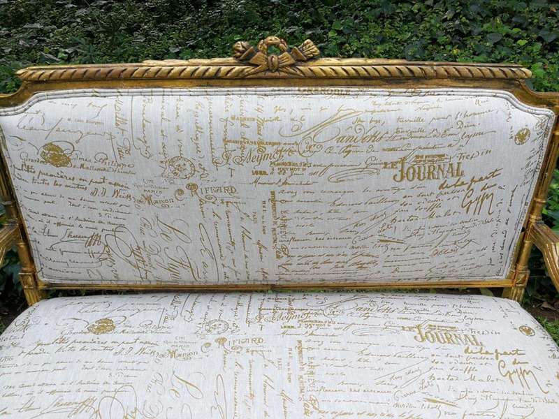 A French Style Hand-Gilded Beechwood Settee Upholstered In A Custom-Made Handmade Linen With Scri...
