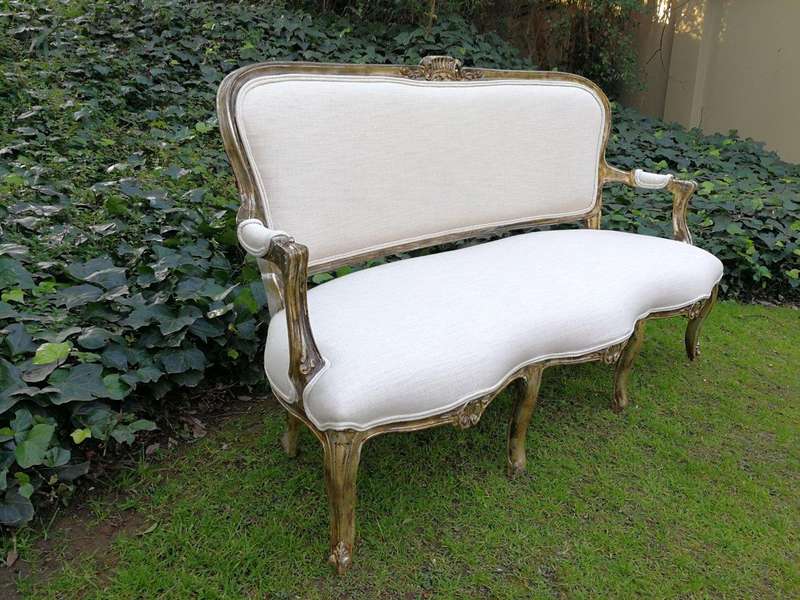 A 20th Century Carved And Hand-Gilded French Style Settee Upholstered In An Imported Linen
