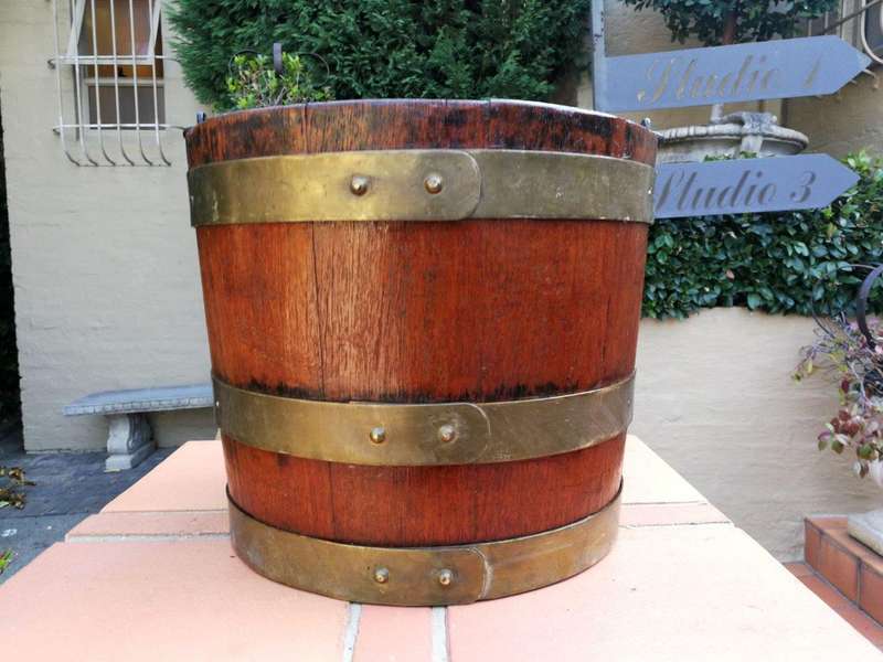 A 20th Century Teak Water Bucket with Brand Bands and Iron Handle ND