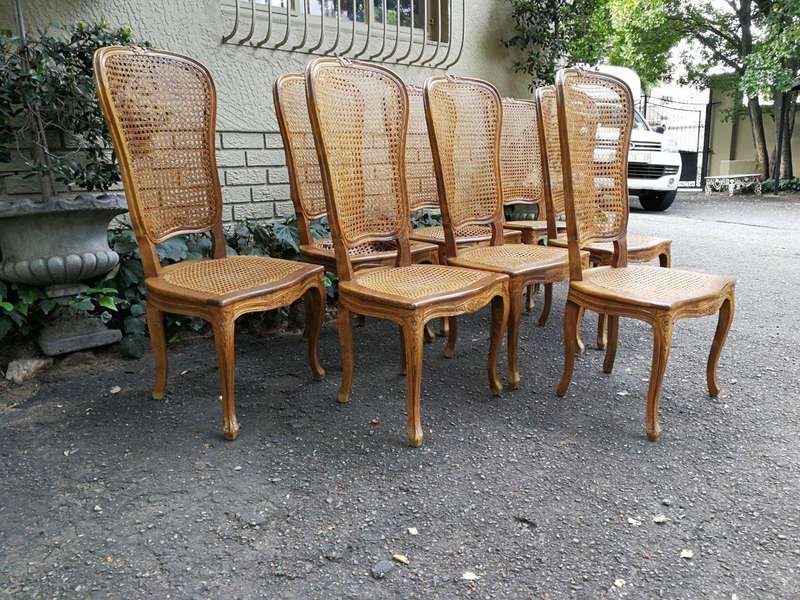 A 20th Century Circa Mid 1950s Set Of Eight French Carved Oak Dining Chairs