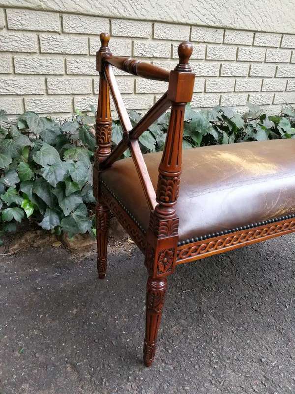 A 20th Century French Carved Mahogany Ottoman With Gilt Tooled Brown Leather