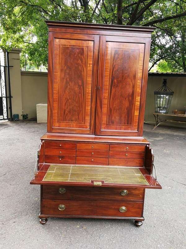 A Mid 19th Century Victorian Mahogany Secretaire. The interior fitted with a gilt-tooled green le...