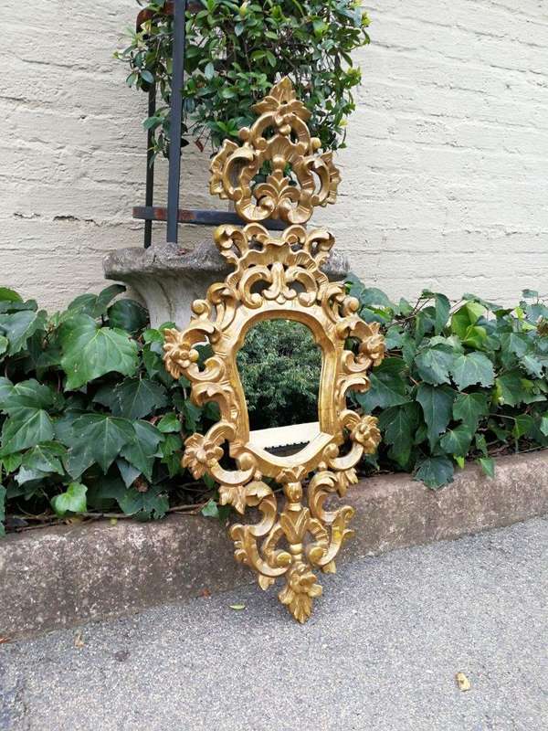 A 20th Century French Style Ornately Carved and Gilt Painted Wooden Mirror