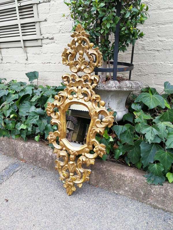 A 20th Century French Style Ornately Carved and Gilt Painted Wooden Mirror
