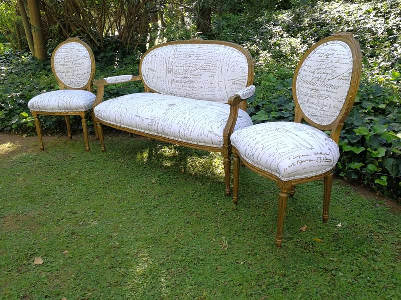 An Early 20th Century Set Of French Giltwood Louis XVI Style Settee And Pair of Chairs Upholstere...