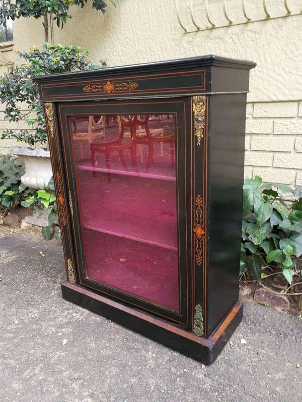 An Antique Victorian Ebonised And Marquetry Pier Cabinet With Gilt Metal Mounts And Key