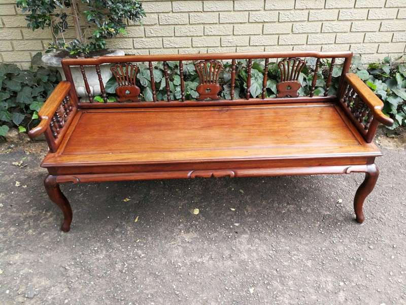 A 20th Century Ornately Carved Hardwood Bench