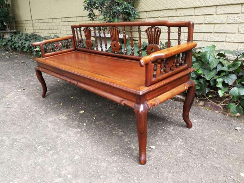 A 20th Century Ornately Carved Hardwood Bench