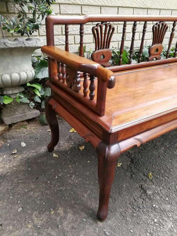A 20th Century Ornately Carved Hardwood Bench