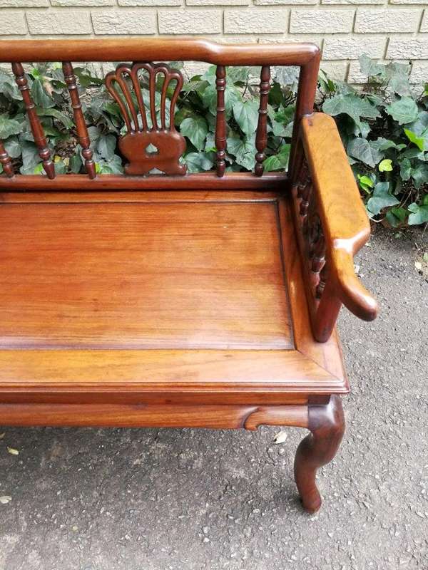 A 20th Century Ornately Carved Hardwood Bench