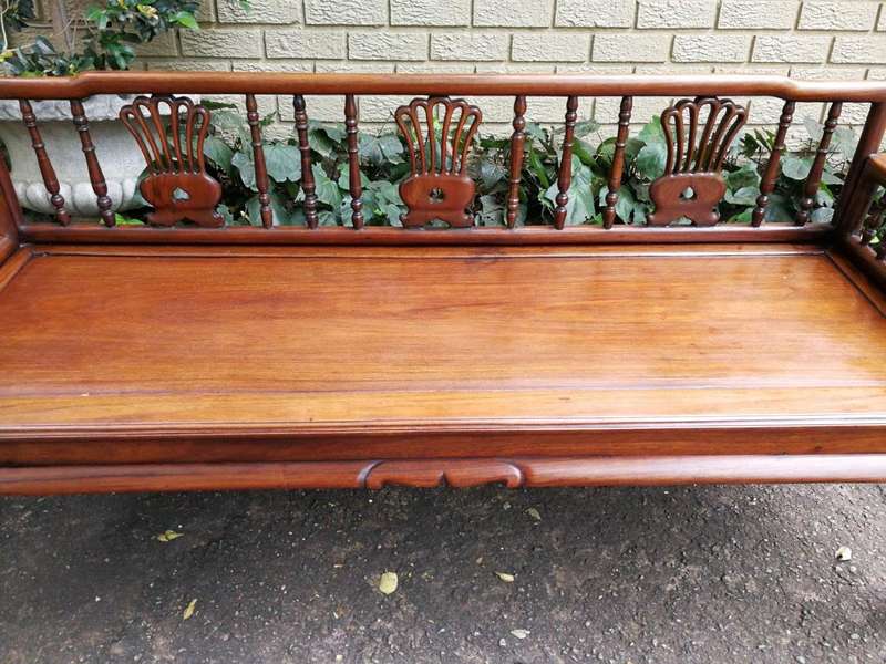 A 20th Century Ornately Carved Hardwood Bench