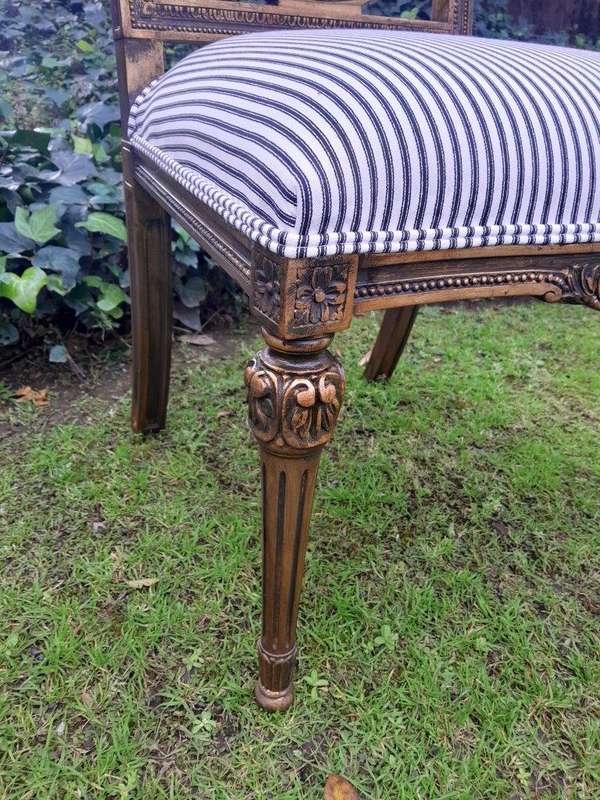 A Pair of French Style Hand-Gilded Chairs