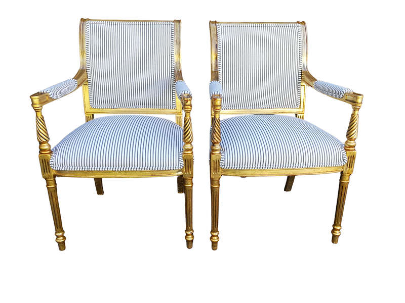 A Pair Of Carved And Gilded Armchairs