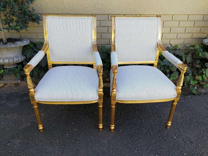 A Pair Of Carved And Gilded Armchairs