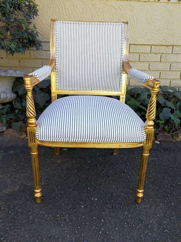 A Pair Of Carved And Gilded Armchairs