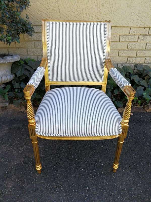 A Pair Of Carved And Gilded Armchairs