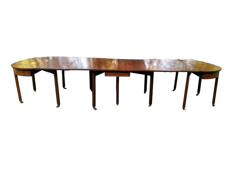 A 19TH Century Circa 1810 George III Mahogany Extension Dining Table with Brass Castors