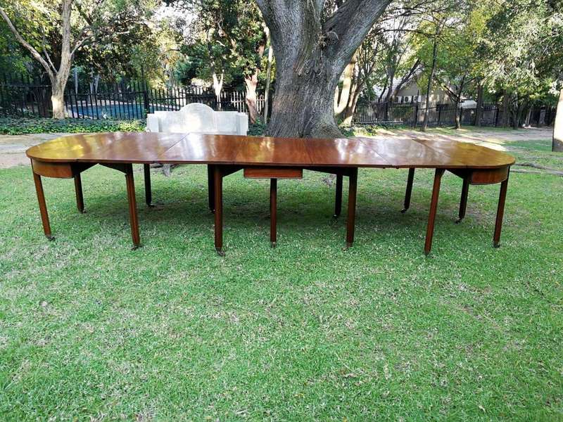 A 19TH Century Circa 1810 George III Mahogany Extension Dining Table with Brass Castors