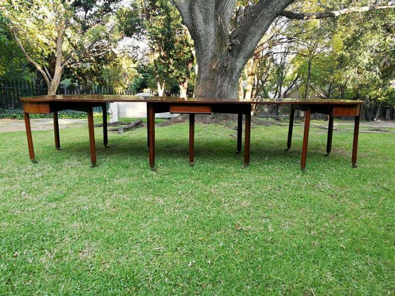 A 19TH Century Circa 1810 George III Mahogany Extension Dining Table with Brass Castors