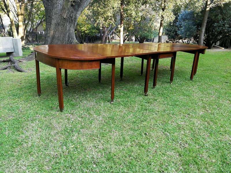 A 19TH Century Circa 1810 George III Mahogany Extension Dining Table with Brass Castors
