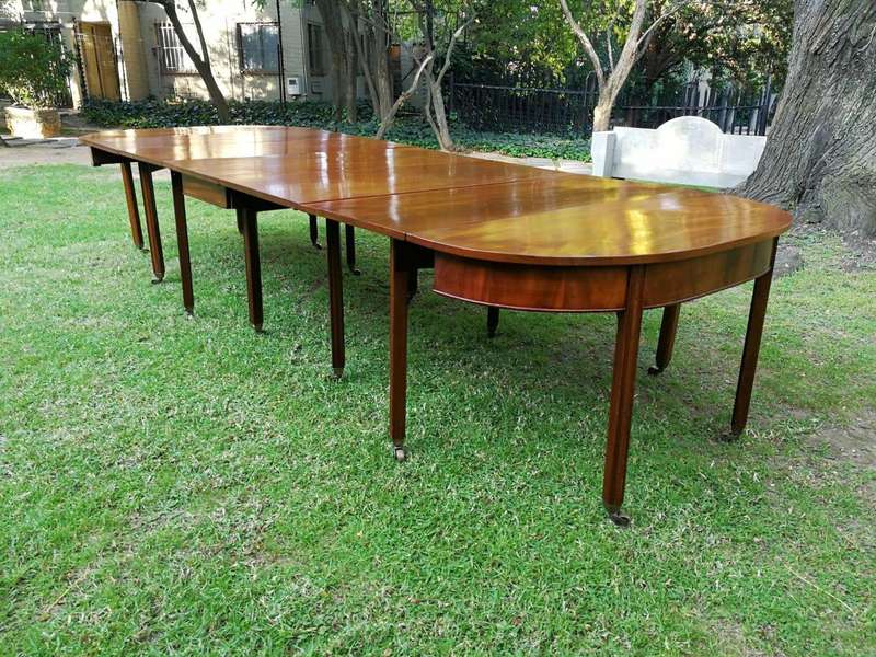 A 19TH Century Circa 1810 George III Mahogany Extension Dining Table with Brass Castors