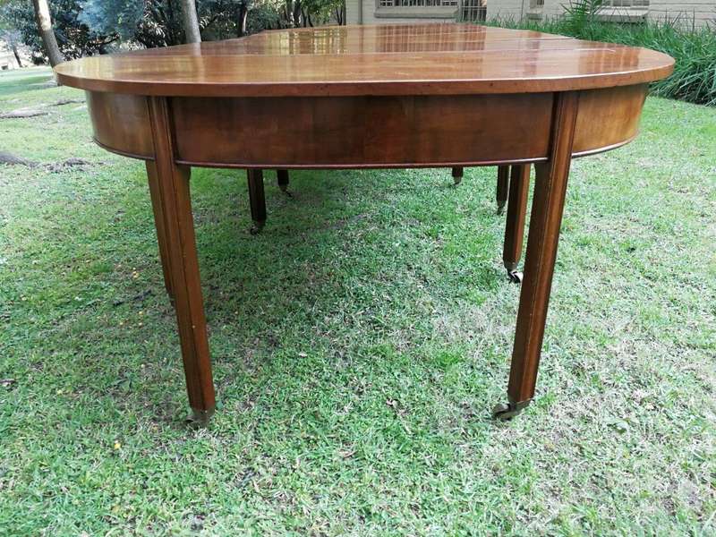A 19TH Century Circa 1810 George III Mahogany Extension Dining Table with Brass Castors