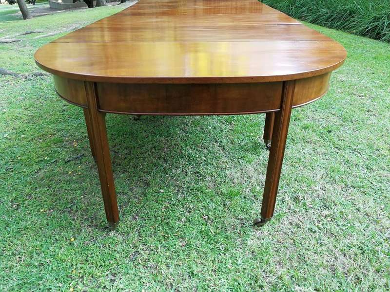 A 19TH Century Circa 1810 George III Mahogany Extension Dining Table with Brass Castors