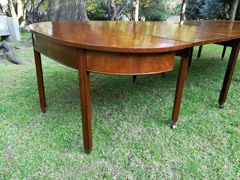 A 19TH Century Circa 1810 George III Mahogany Extension Dining Table with Brass Castors