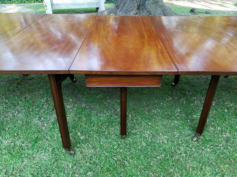 A 19TH Century Circa 1810 George III Mahogany Extension Dining Table with Brass Castors