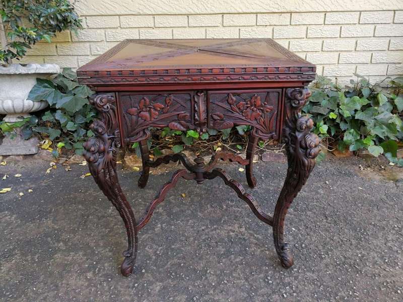 A 20th Century Carved Wooden Games Table with Four Drawers and Interior with Baize and Four Drawers