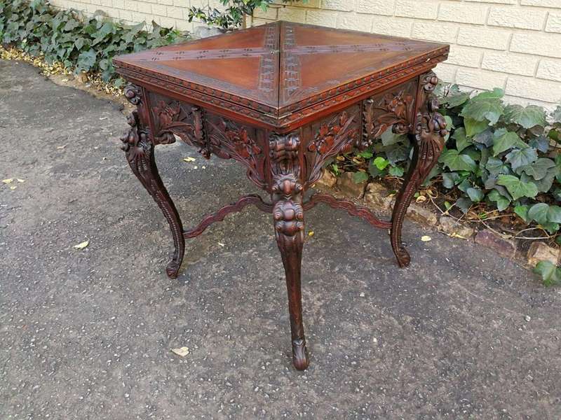 A 20th Century Carved Wooden Games Table with Four Drawers and Interior with Baize and Four Drawers