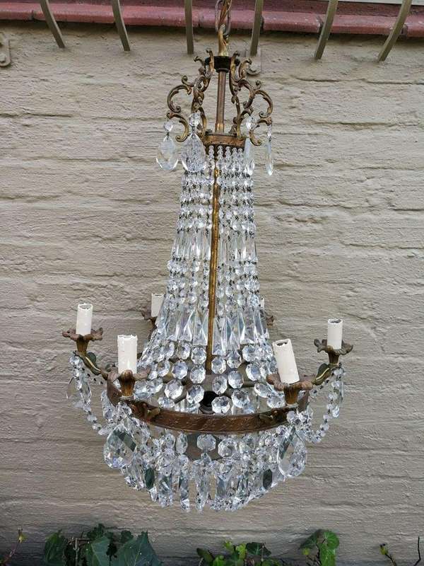 A 20th Century French Style Empire Brass and Crystal Chandelier