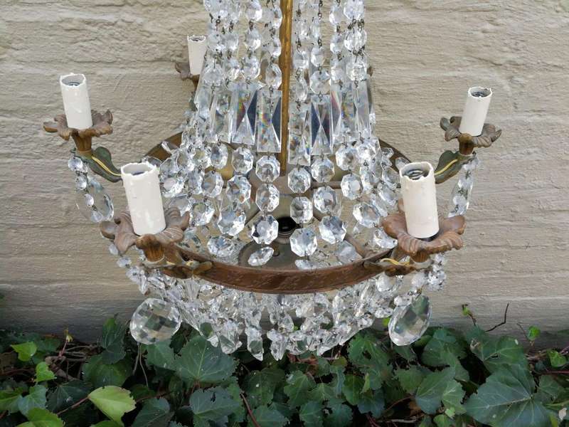 A 20th Century French Style Empire Brass and Crystal Chandelier
