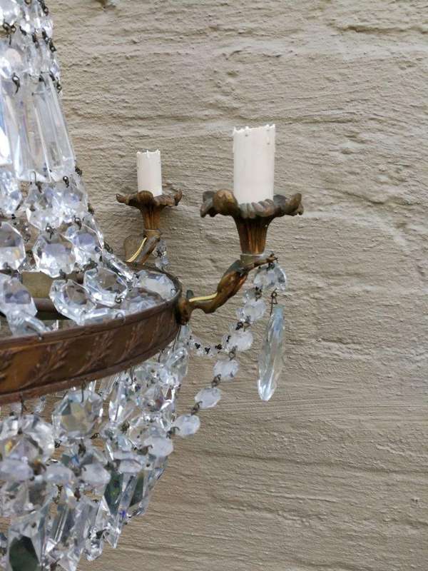 A 20th Century French Style Empire Brass and Crystal Chandelier