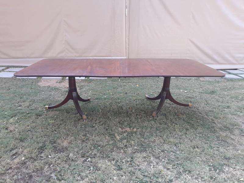A 20th Century Mahogany Dining Table with Two Extensions and Brass Feet & Casters