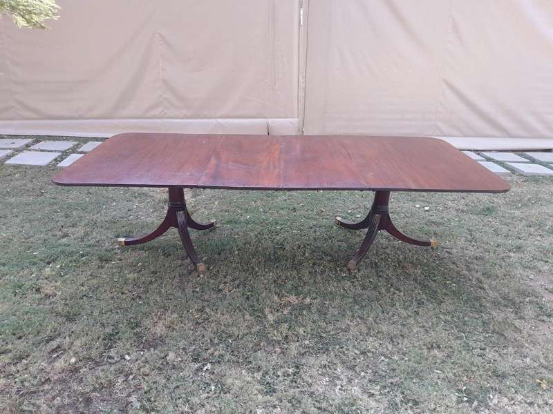 A 20th Century Mahogany Dining Table with Two Extensions and Brass Feet & Casters