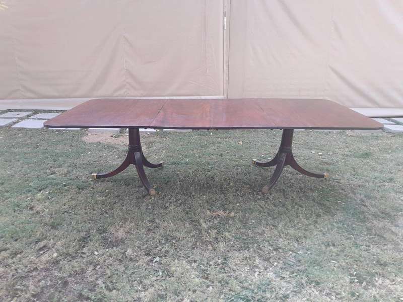 A 20th Century Mahogany Dining Table with Two Extensions and Brass Feet & Casters