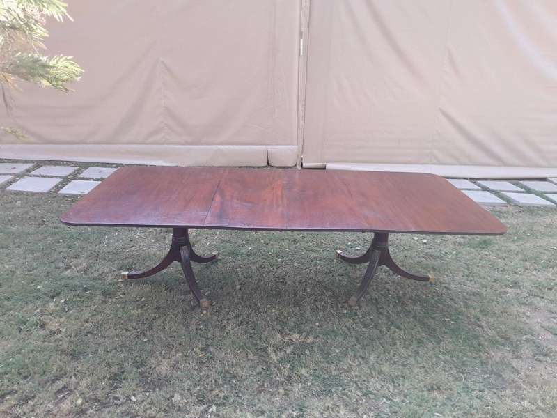 A 20th Century Mahogany Dining Table with Two Extensions and Brass Feet & Casters