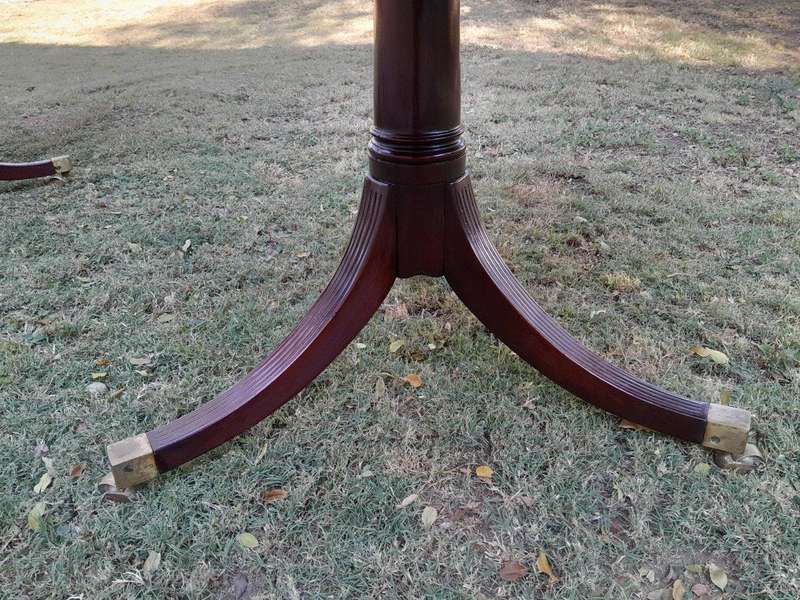 A 20th Century Mahogany Dining Table with Two Extensions and Brass Feet & Casters