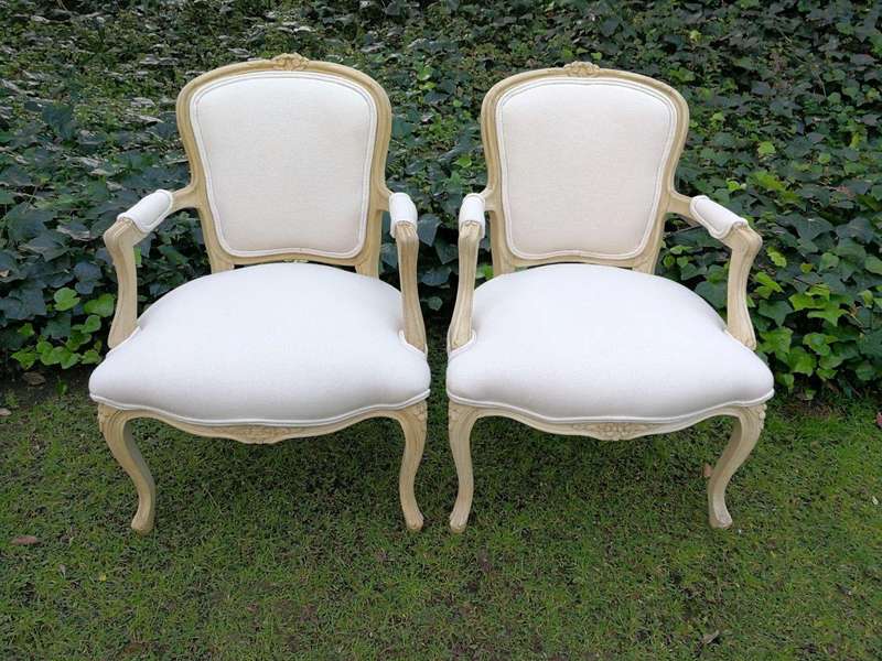 A Pair of 20th Century French Rococo Style Oak Armchairs in a bleached / natural finish