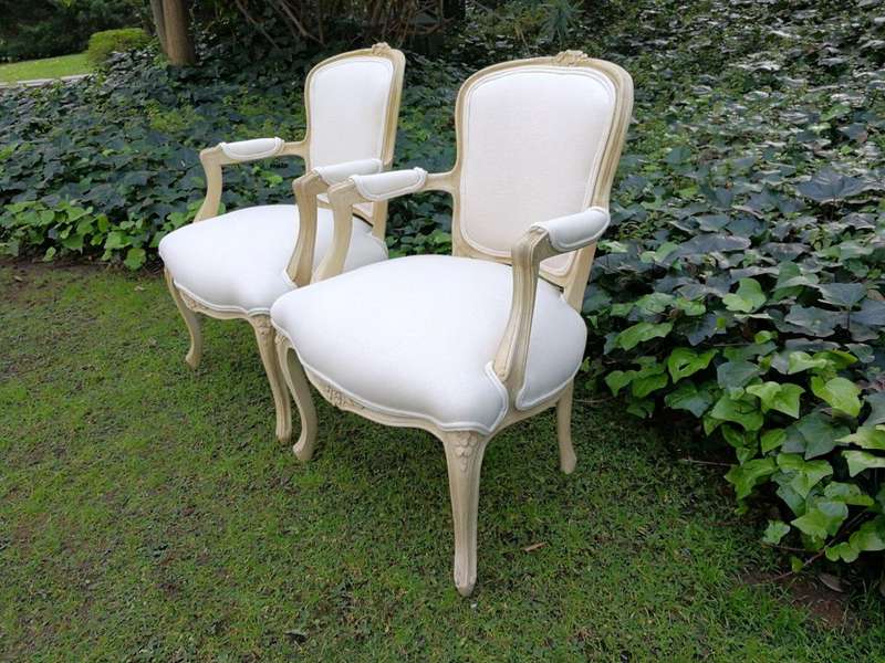 A Pair of 20th Century French Rococo Style Oak Armchairs in a bleached / natural finish
