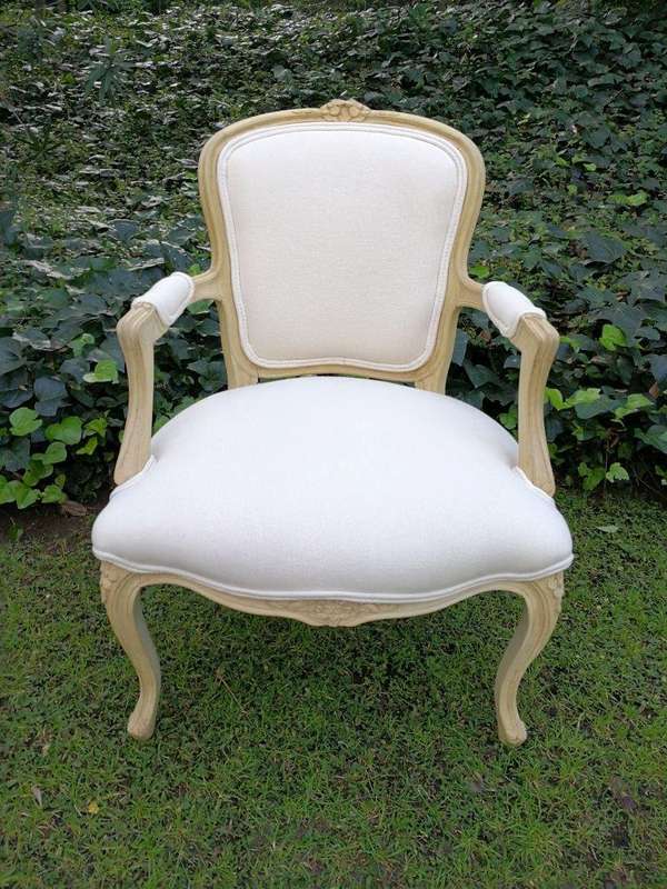 A Pair of 20th Century French Rococo Style Oak Armchairs in a bleached / natural finish