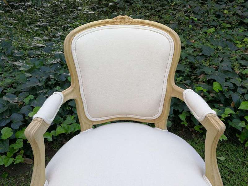 A Pair of 20th Century French Rococo Style Oak Armchairs in a bleached / natural finish