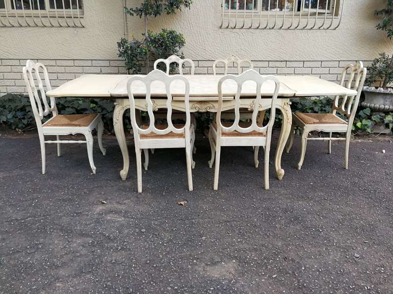 A 20TH Century French Set of Six Carved Dining Chairs with Rush Seats in a Contemporary Bleached ...