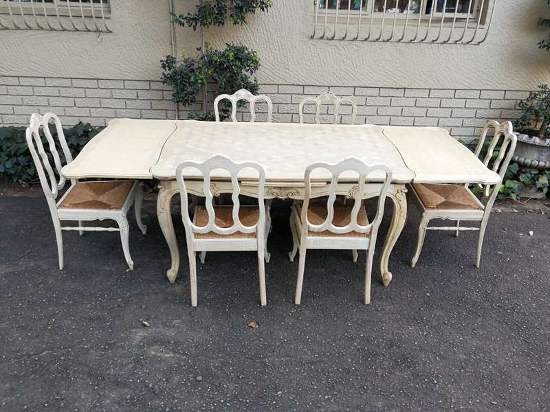 A 20TH Century French Set of Six Carved Dining Chairs with Rush Seats in a Contemporary Bleached ...