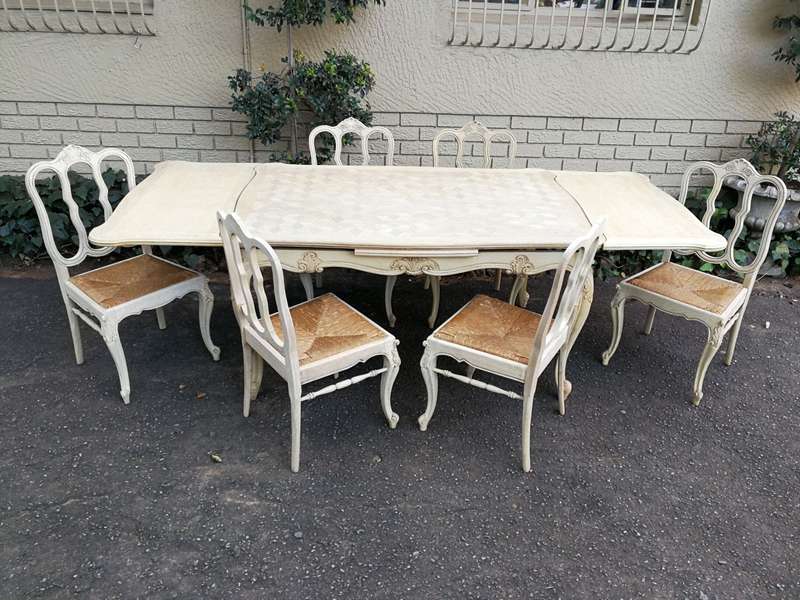 A 20TH Century French Set of Six Carved Dining Chairs with Rush Seats in a Contemporary Bleached ...