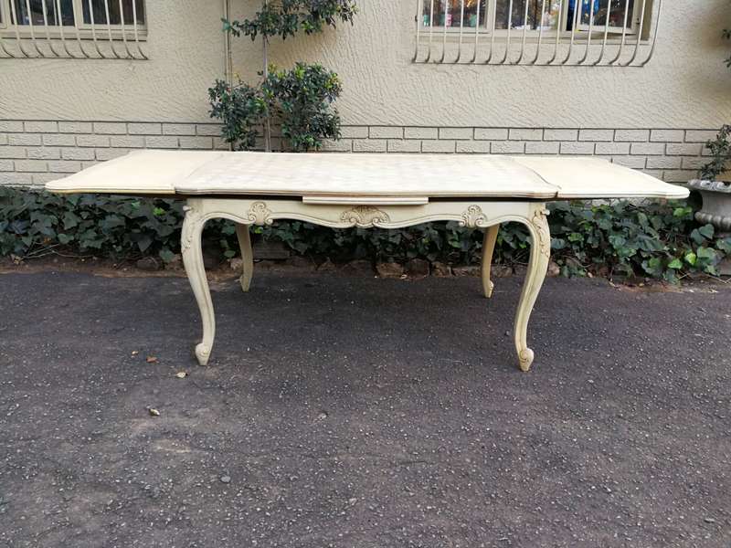 A 20TH Century French Set of Six Carved Dining Chairs with Rush Seats in a Contemporary Bleached ...